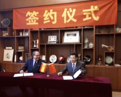 Signing with President Chen Fachun